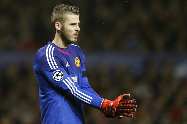 Manchester United's goalkeeper David de Gea ajusts his gloves during the Champions League Group B soccer match between Manchester United and CSKA Moskva at Old Trafford Stadium, Manchester, England, Tuesday, Nov. 3, 2015. (AP Photo/Jon Super)