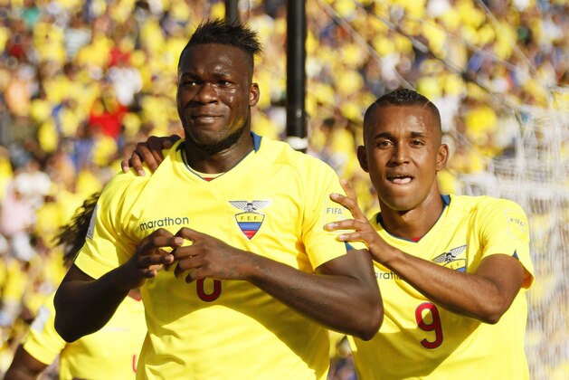 Ecuador’s Felipe Caicedo, left, celebrates with his teammate Fidel Martinez, after scoring against Uruguay during a 2018 World Cup qualifying soccer match in Quito, Ecuador, Thursday, Nov. 12, 2015. (AP Photo/Franklin Jacome )