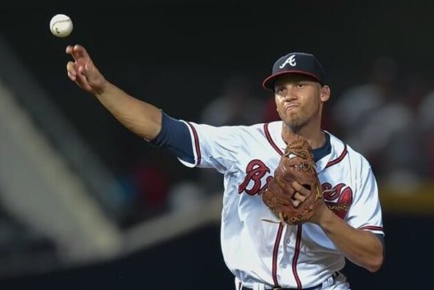 Atlanta Braves shortstop Andrelton Simmons (19) throws to first base for an out on Washington Nationals' Anthony Rendon during the sixth inning of a baseball game, Wednesday, Sept. 30, 2015, in Atlanta. (AP Photo/Jon Barash)