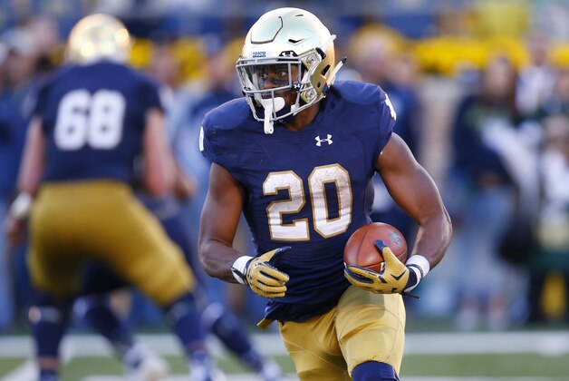 Notre Dame running back C.J. Prosise (20) runs the ball against Navy during the second half of an NCAA college football game, Saturday, Oct. 10, 2015, in South Bend, Ind. Notre Dame won the game 41-24. (AP Photo/Jeff Haynes)