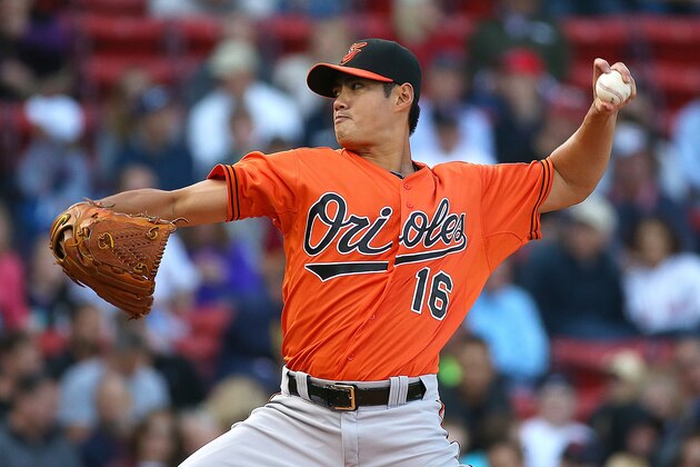 BOSTON, MA - SEPTEMBER 26: Wei-Yin Chen #16 of the Baltimore Orioles throws against the Boston Red Sox in the first inning at Fenway Park on September 26, 2015 in Boston, Massachusetts.  (Photo by Jim Rogash/Getty Images)
