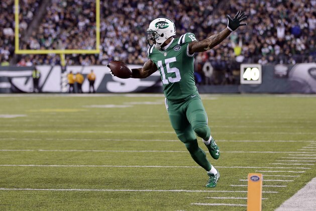New York Jets wide receiver Brandon Marshall (15) gestures before scoring a touchdown against the Buffalo Bills during the second half of an NFL football game, Thursday, Nov. 12, 2015, in East Rutherford, N.J. (AP Photo/Seth Wenig)