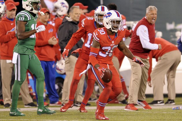 Buffalo Bills head coach Rex Ryan, right, celebrates moments after strong safety Bacarri Rambo, center, intercepted a pass from New York Jets quarterback Ryan Fitzpatrick, not pictured, to secure a 22-17 victory during an NFL football game, Thursday, Nov. 12, 2015, in East Rutherford, N.J. (AP Photo/Bill Kostroun)