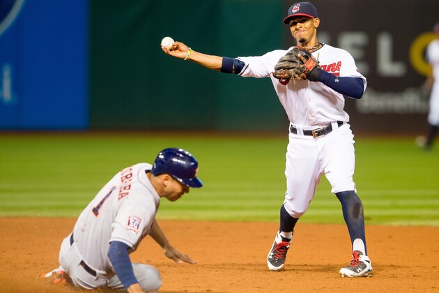 CLEVELAND, OH -  JULY 7: Shortstop Francisco Lindor #12 of the Cleveland Indians throws out Evan Gattis #11 of the Houston Astros at first as Carlos Correa #1 is out at second for the double play to end the top of the eighth inning at Progressive Field on July 7, 2015 in Cleveland, Ohio. (Photo by Jason Miller/Getty Images)