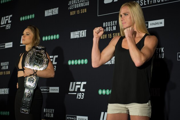 MELBOURNE, AUSTRALIA - NOVEMBER 13:  (L-R) UFC women's bantamweight champion Ronda Rousey of the United States and Holly Holm of the United States pose for a photo during the UFC 193 Ultimate Media Day festivities at Etihad Stadium on November 13, 2015 in Melbourne, Australia. (Photo by Brandon Magnus/Zuffa LLC/Zuffa LLC via Getty Images)