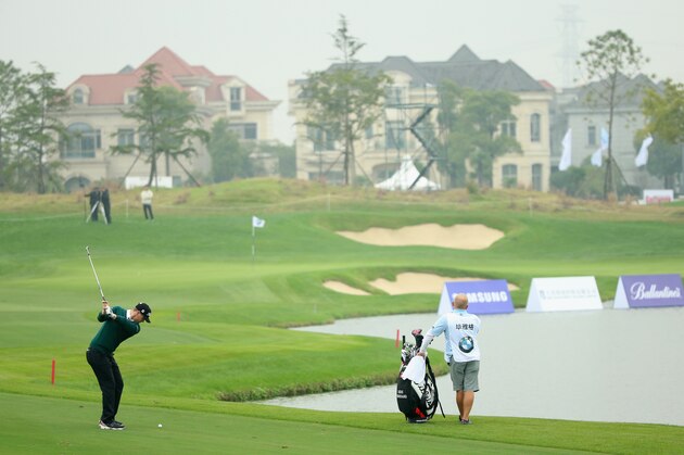 SHANGHAI, CHINA - NOVEMBER 13:  Lucas Bjerregaard of Denmark plays his second shot on the ninth hole during the second round of the BMW Masters at Lake Malaren Golf Club on November 13, 2015 in Shanghai, China.  (Photo by Andrew Redington/Getty Images)