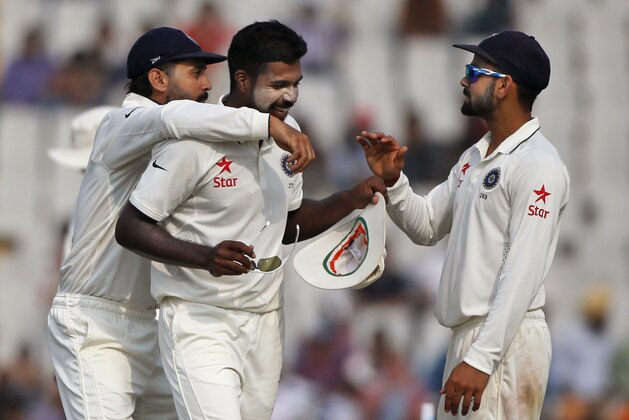 India's Varun Aaron, centre, captain Virat Kohli, right, and Murali Vijay celebrate the wicket of South Africa's Simon Harmer during the third day of their first cricket test match against South Africa in Mohali, India, Saturday, Nov. 7, 2015. India won by 108 runs. (AP Photo/Tsering Topgyal) India's Varun Aaron, centre, captain Virat Kohli, right, and Murali Vijay celebrate the wicket of South Africa's Simon Harmer during the third day of their first cricket test match against South Africa in Mohali, India, Saturday, Nov. 7, 2015. India won by 108 runs. (AP Photo/Tsering Topgyal)
