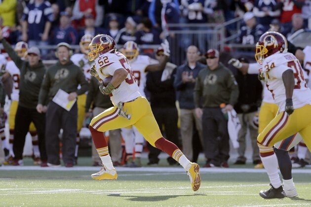 Washington Redskins linebacker Keenan Robinson (52) runs after intercepting a pas by New England Patriots quarterback Tom Brady during the first half of an NFL football game, Sunday, Nov. 8, 2015, in Foxborough, Mass. (AP Photo/Charles Krupa)