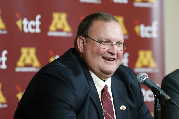 Newly named University of Minnesota head football coach Tracy Claeys is introduced to a news conference Wednesday, Nov. 11, 2015 in Minneapolis. Claeys has served as interim head coach after the sudden retirement announcement by former head coach Jerry Kill.  (AP Photo/Jim Mone)