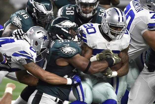Philadelphia Eagles' Brandon Graham (55), Jordan Hicks (58) and Bennie Logan (96) attempt to tackle Dallas Cowboys' Darren McFadden (20) on a run in the second half of an NFL football game Sunday, Nov. 8, 2015, in Arlington, Texas. (AP Photo/Michael Ainsworth)