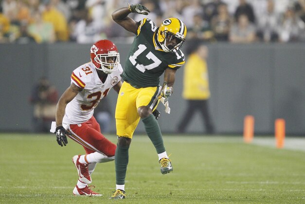 Green Bay Packers' Davante Adams can't catch a ball in front of Kansas City Chiefs' Marcus Cooper during the first half of an NFL football game Monday, Sept. 28, 2015, in Green Bay, Wis. (AP Photo/Matt Ludtke)