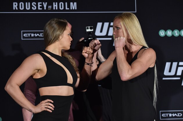 Ronda Rousey of the US (L) faces-off with compatriot Holly Holm (R) for the UFC fight in Melbourne on November 13, 2015. Over 55,000 are expected to attend the UFC fight between Rousey and compatriot Holly Holm in Melbourne on November 15. RESTRICTED TO EDITORIAL USE NO ADVERTISING USE NO PROMOTIONAL USE NO MERCHANDISING USE AFP PHOTO/Paul CROCK         (Photo credit should read PAUL CROCK/AFP/Getty Images)