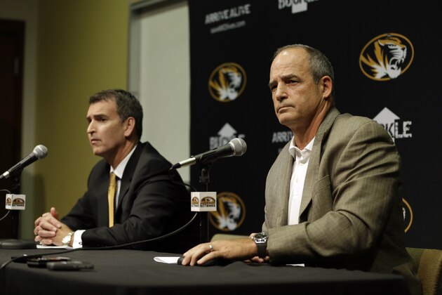 Missouri Athletics Director Mack Rhoades, left, and head football coach Gary Pinkel address the media Monday, Nov. 9, 2015, in Columbia, Mo. Football will resume at Missouri following the resignation of University of Missouri system president Tim Wolfe after several members of the team, pointing to Wolfe’s inaction in handling of racial tensions at the school, announced over the weekend that they would not play until the president was gone. (AP Photo/Jeff Roberson)