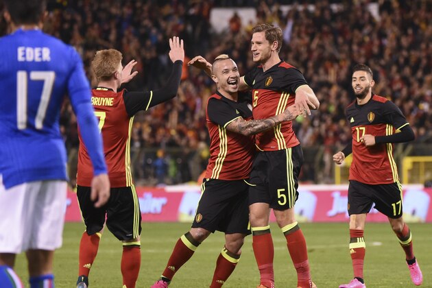 Belgium’s Jan Vertonghen, center, celebrates with teammates Kevin De Bruyne, left,  Radja Nainggolan,Yannick Carrasco after scoring during a friendly soccer match between Belgium and Italy at the King Baudouin stadium in Brussels on Friday, Nov. 13, 2015. (AP Photo/Geert Vanden Wijngaert)