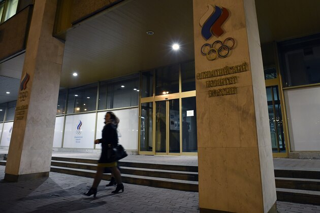 Women leave the Russian Olympic Committee building which houses the headquarters of the All-Russian Athletics Federation in Moscow on November 9, 2015. Russian athletics should be suspended from all competition, including the 2016 Olympic Games, a damning report by World Anti-Doping Agency's (WADA) independent commission into widespread doping and corruption urged on November 9. AFP PHOTO / YURI KADOBNOV        (Photo credit should read YURI KADOBNOV/AFP/Getty Images)
