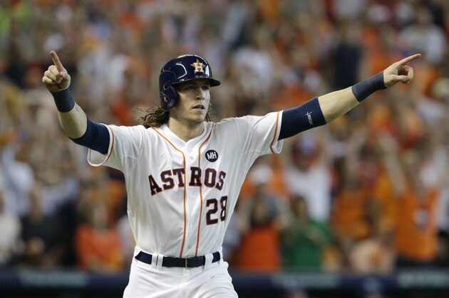 Houston Astros' Colby Rasmus (28) celebrates after hitting a solo home run against the Kansas City Royals in the seventh inning during Game 4 of baseball's American League Division Series, Monday, Oct. 12, 2015, in Houston. (AP Photo/Pat Sullivan)