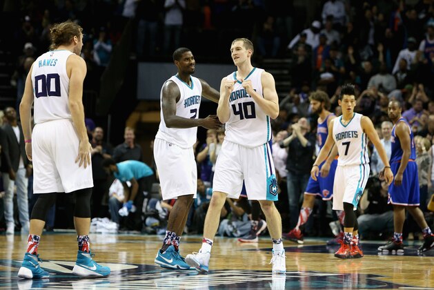 CHARLOTTE, NC - NOVEMBER 11:  Cody Zeller #40 celebrates with teammates Marvin Williams #2 and Spencer Hawes #00 of the Charlotte Hornets after hitting the game winning shot to defeat the New York Knicks 95-93 during their game at Time Warner Cable Arena on November 11, 2015 in Charlotte, North Carolina. NOTE TO USER: User expressly acknowledges and agrees that, by downloading and or using this photograph, User is consenting to the terms and conditions of the Getty Images License Agreement.  (Photo by Streeter Lecka/Getty Images)