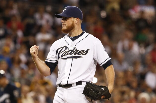 San Diego Padres closer Craig Kimbrel pumps his fist after striking out the final batter against the Milwaukee Brewers in the ninth inning of a baseball game won 3-1 by the Padres Thursday, Oct. 1, 2015, in San Diego.  (AP Photo/Lenny Ignelzi)