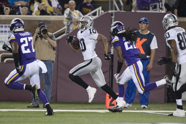 MINNEAPOLIS, MN - AUGUST 22: Seth Roberts #10 of the Oakland Raiders carries the ball against Shaun Prater #27 and Trae Waynes #26 of the Minnesota Vikings during the preseason game on August 22, 2014 at TCF Bank Stadium in Minneapolis, Minnesota. The Vikings defeated the Raiders 20-12. (Photo by Hannah Foslien/Getty Images)