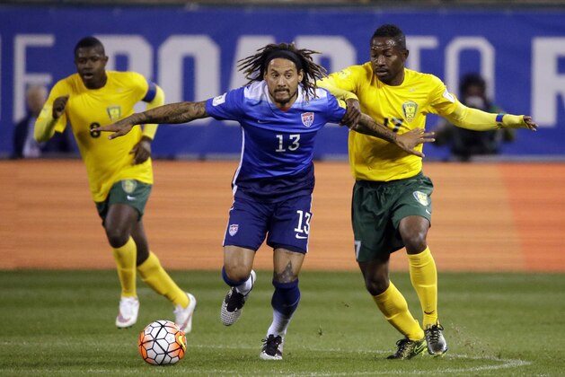 United States’ Jermaine Jones (13) controls the ball as St. Vincent and the Grenadines’ Dorren Hamlet, left, and Seinard Bowens, right, defend during the first half of a 2018 World Cup qualifying soccer match Friday, Nov. 13, 2015, in St. Louis. (AP Photo/Jeff Roberson)