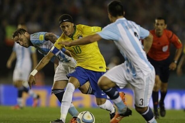 Brazil's Neymar, center, dribbles past Argentina's Lucas Biglia, left, and Facundo Roncaglia during a 2018 World Cup qualifying soccer match in Buenos Aires, Argentina, Friday, Nov. 13, 2015. (AP Photo/Natacha Pisarenko)