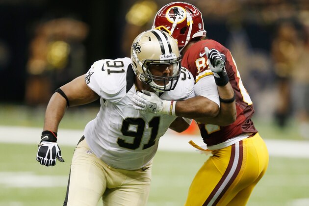 NEW ORLEANS, LA - SEPTEMBER 09:  Will Smith #91 of the New Orleans Saints tries to get around   Niles Paul #84 of the Washington Redskins during the season opener at Mercedes-Benz Superdome on September 9, 2012 in New Orleans, Louisiana.  The Redskins defeated the Saints 40-32.  (Photo by Chris Graythen/Getty Images)