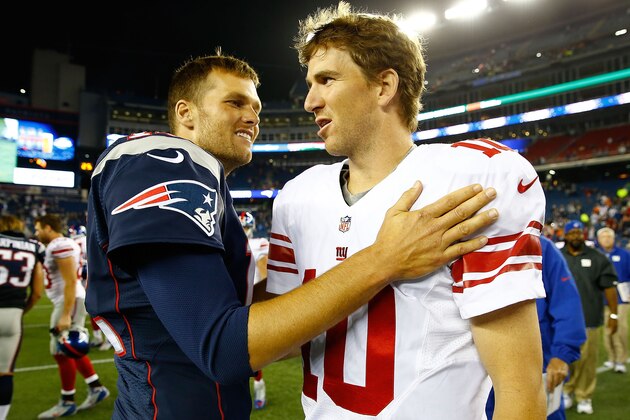 FOXBORO, MA - AUGUST 29: Tom Brady #12 of the New England Patriots talks to Eli Manning #10 of the New York Giants following their preseason game at Gillette Stadium on August 29, 2013 in Foxboro, Massachusetts. (Photo by Jared Wickerham/Getty Images)