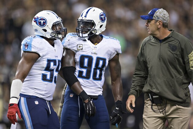 NEW ORLEANS, LA - NOVEMBER 8:  Head Coach Mike Mularkey and Wesley Woodyard #59 help Brian Orakpo #98 of the Tennessee Titans off the field after being called for a penalty during a game against the New Orleans Saints at Mercedes-Benz Superdome on November 8, 2015 in New Orleans, Louisiana.  The Titans defeated the Saints in overtime 34-28.  (Photo by Wesley Hitt/Getty Images)