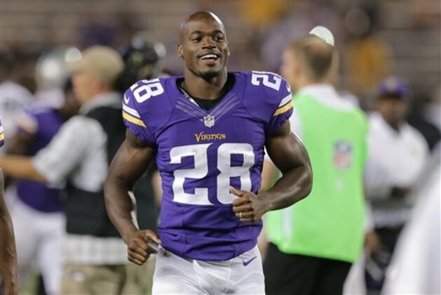 FILE - In this Aug. 8, 2014, file photo, Minnesota Vikings running back Adrian Peterson (28) runs off the field after a exhibition NFL football game against the Oakland Raiders at TCF Bank Stadium in Minneapolis. Adrian Peterson avoided jail time on Tuesday, Nov. 4, 2014,  in a plea agreement reached with prosecutors to resolve his child abuse case. (AP Photo/Jim Mone, File)