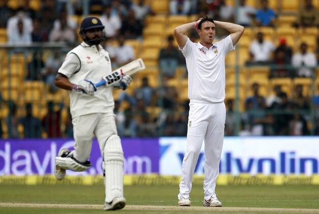 South Africa's Kyle Abbott, right, reacts after India's Shikhar Dhawan hit a boundary on his delivery during the first day of their second cricket test match in Bangalore, India, Saturday, Nov. 14, 2015. On the left is India's Murali Vijay. (AP Photo/Aijaz Rahi) South Africa's Kyle Abbott, right, reacts after India's Shikhar Dhawan hit a boundary on his delivery during the first day of their second cricket test match in Bangalore, India, Saturday, Nov. 14, 2015. On the left is India's Murali Vijay. (AP Photo/Aijaz Rahi)