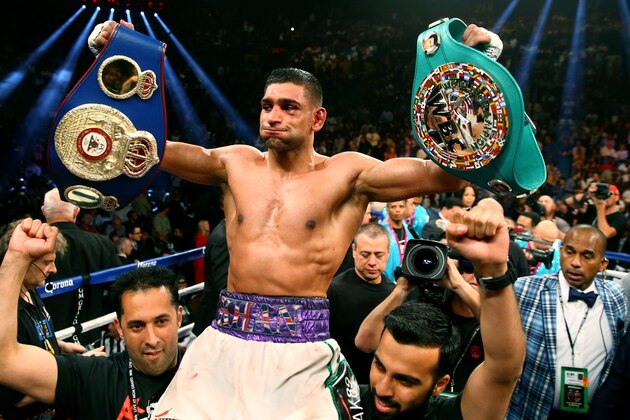 May 3, 2014; Las Vegas, NV, USA; Amir Khan celebrates after defeating Luis Collazo (not pictured) during their fight at MGM Grand. Mandatory Credit: Mark J. Rebilas-USA TODAY Sports