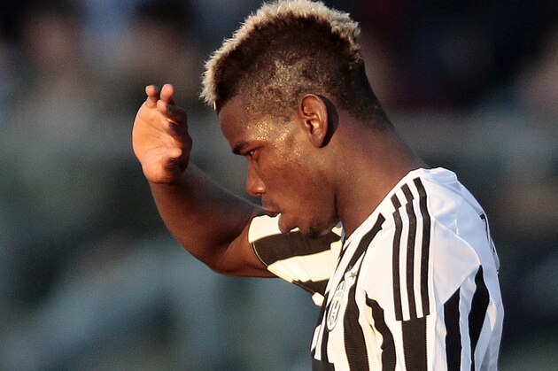 Juventus' Paul Pogba walks on the pitch during a Serie A soccer match between Empoli and Juventus, in Empoli's Carlo Castellani's stadium, Italy, Sunday, Nov. 8, 2015. (AP Photo/Paolo Lazzeroni)