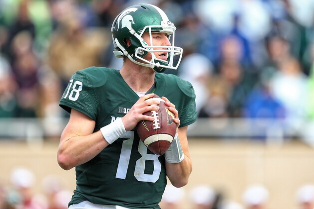 Oct 24, 2015; East Lansing, MI, USA; Michigan State Spartans quarterback Connor Cook (18) attempts to throw the ball against the Indiana Hoosiers during the 1st half of a game at Spartan Stadium. Mandatory Credit: Mike Carter-USA TODAY Sports