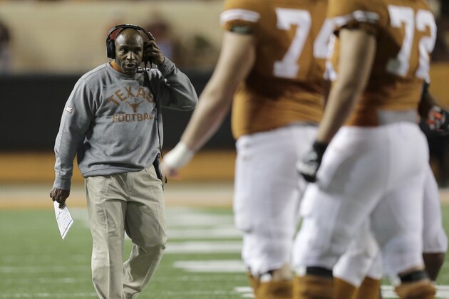 Texas head coach Charlie Strong, left, looks to his players during the first half of an NCAA college football game against Kansas, Saturday, Nov. 7, 2015, in Austin, Texas. (AP Photo/Eric Gay)