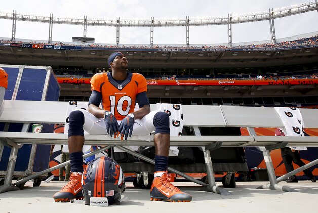 Denver Broncos wide receiver Emmanuel Sanders waits to warm up before an NFL football game against the Baltimore Ravens Sunday, Sept. 13, 2015, in Denver. (AP Photo/Jack Dempsey)