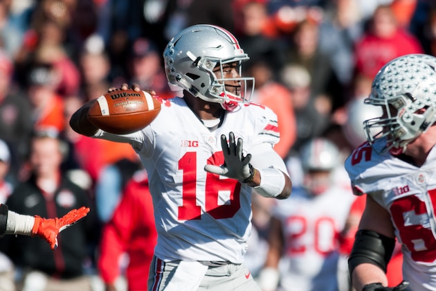 Ohio State quarterback J.T. Barrett (16) throws a pass during the second quarter of an NCAA college football game against Illinois, Saturday, Nov. 14, 2015, at Memorial Stadium in Champaign, Ill.  (AP Photo/Bradley Leeb)
