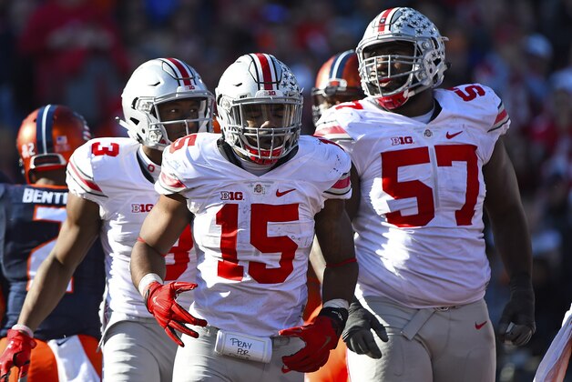 Nov 14, 2015; Champaign, IL, USA; Ohio State Buckeyes running back Ezekiel Elliott (15) celebrates with teammates after scoring a touchdown during the third quarter at Memorial Stadium. Mandatory Credit: Mike DiNovo-USA TODAY Sports