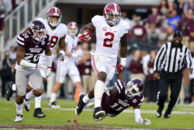 Nov 14, 2015; Starkville, MS, USA; Alabama Crimson Tide running back Derrick Henry (2) avoids a tackle by Mississippi State Bulldogs defensive back Kivon Coman (11) during a run that would result in a touchdown during the second quarter at Davis Wade Stadium. Mandatory Credit: Matt Bush-USA TODAY Sports