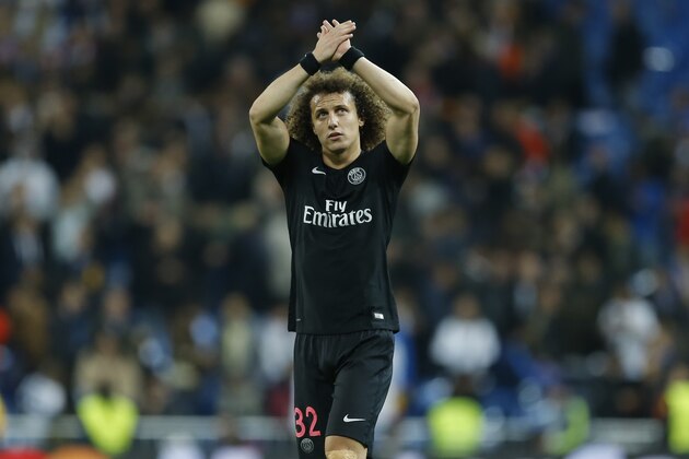 PSG's David Luiz waves to his team's supporters after the Champions League group A soccer match between Real Madrid and PSG at the Santiago Bernabeu stadium in Madrid, Tuesday, Nov. 3, 2015. Real Madrid won 1-0. (AP Photo/Francisco Seco)
