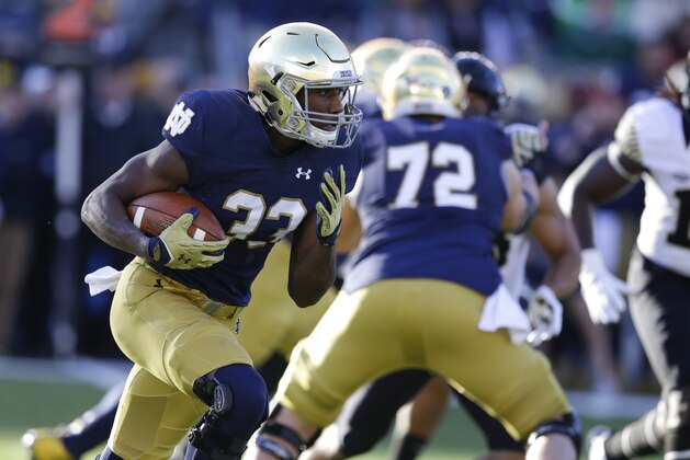 Notre Dame running back Josh Adams (33) runs against Wake Forest during the first half of an NCAA college football game in South Bend, Ind., Saturday, Nov. 14, 2015. (AP Photo/Michael Conroy)