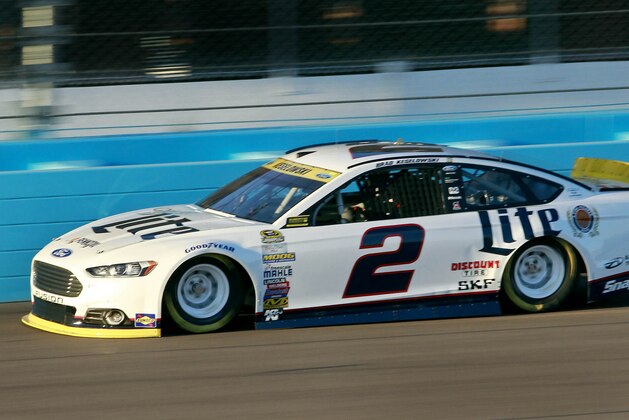 Brad Keselowski drives into Turn 1 during qualifying for Sunday's NASCAR Sprint Cup series auto race at Phoenix International Raceway, Friday, Nov. 13, 2015 in Avondale, Ariz. (AP Photo/Ralph Freso)