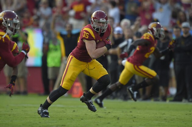 Southern California linebacker Cameron Smith runs the ball after intercepting it during the first half of an NCAA college football game against Utah, Saturday, Oct. 24, 2015, in Los Angeles. (AP Photo/Mark J. Terrill)