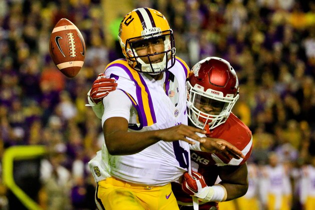 Nov 14, 2015; Baton Rouge, LA, USA; Arkansas Razorbacks linebacker Dre Greenlaw (23) forces LSU Tigers quarterback Brandon Harris (6) to fumble  during the second quarter of a game at Tiger Stadium. Mandatory Credit: Derick E. Hingle-USA TODAY Sports