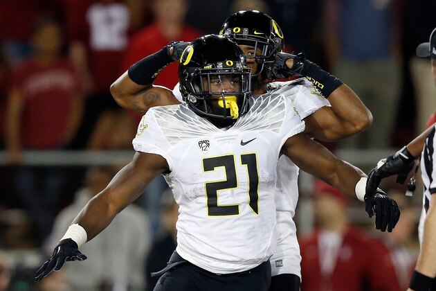 PALO ALTO, CA - NOVEMBER 14:  Royce Freeman #21 and Dwayne Stanford #88 of the Oregon Ducks celebrate after Freeman score a touchdown against the Stanford Cardinal at Stanford Stadium on November 14, 2015 in Palo Alto, California.  (Photo by Ezra Shaw/Getty Images)