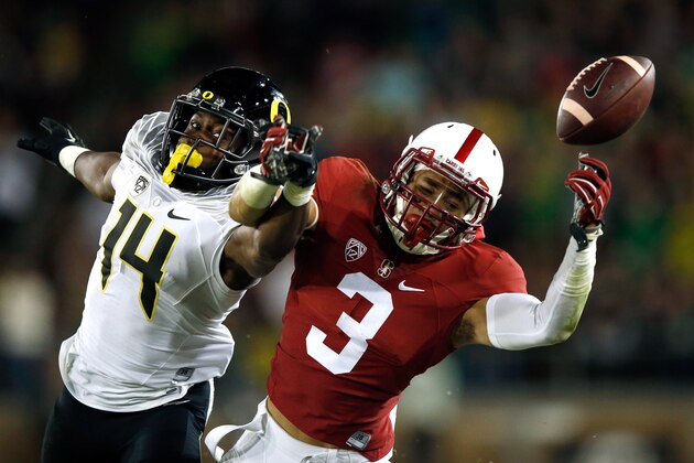 PALO ALTO, CA - NOVEMBER 14:  Ugo Amadi #14 of the Oregon Ducks breaks up a pass intended for Michael Rector #3 of the Stanford Cardinal at Stanford Stadium on November 14, 2015 in Palo Alto, California.  (Photo by Ezra Shaw/Getty Images)
