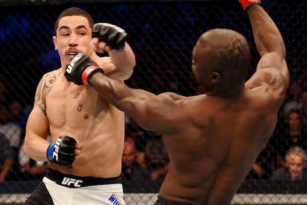 MELBOURNE, AUSTRALIA - NOVEMBER 15:  (L-R) Robert Whittaker throws a left-handed punch against Uriah Hall in their middleweight bout during the UFC 193 event at Etihad Stadium on November 15, 2015 in Melbourne, Australia.  (Photo by Josh Hedges/Zuffa LLC/Zuffa LLC via Getty Images)