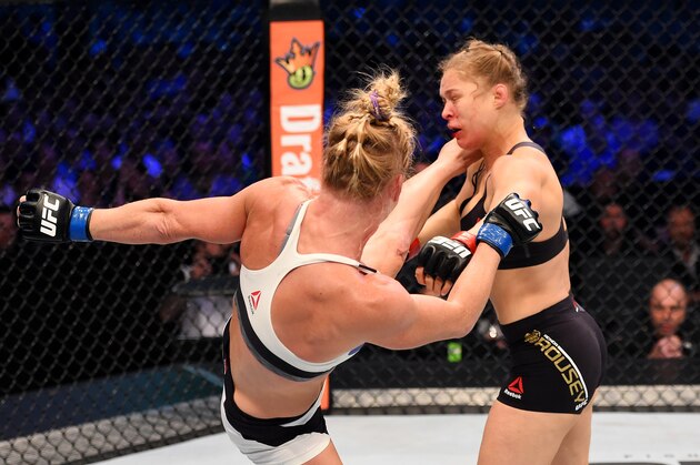 MELBOURNE, AUSTRALIA - NOVEMBER 15: (L-R) Holly Holm lands a left-high kick against Ronda Rousey in the second round of their UFC women's bantamweight championship bout during the UFC 193 event at Etihad Stadium on November 15, 2015 in Melbourne, Australia.  (Photo by Josh Hedges/Zuffa LLC/Zuffa LLC via Getty Images)