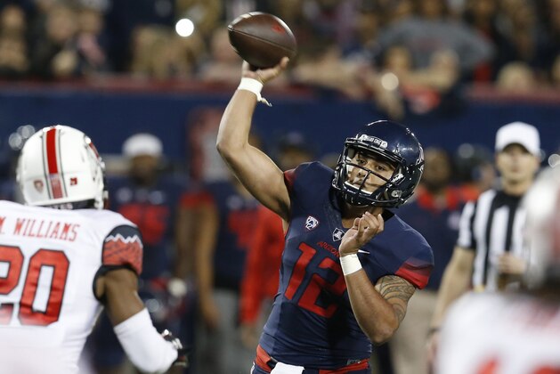Arizona quarterback Anu Solomon throws down field during the first half of an NCAA college football game against Arizona, Saturday, Nov. 14, 2015, in Tucson, Ariz. (AP Photo/Rick Scuteri)