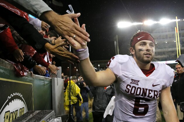 Oklahoma quarterback Baker Mayfield (6) greets fans after their NCAA college football game against Baylor, Saturday, Nov. 14, 2015, in Waco, Texas. Oklahoma won 44-34. (AP Photo/Tony Gutierrez)