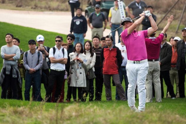 Kristoffer Broberg of Sweden plays a shot during the BMW Shanghai Masters golf tournament at the Lake Malaren Golf Club in Shanghai on November 15, 2015. AFP PHOTO / JOHANNES EISELE        (Photo credit should read JOHANNES EISELE/AFP/Getty Images)